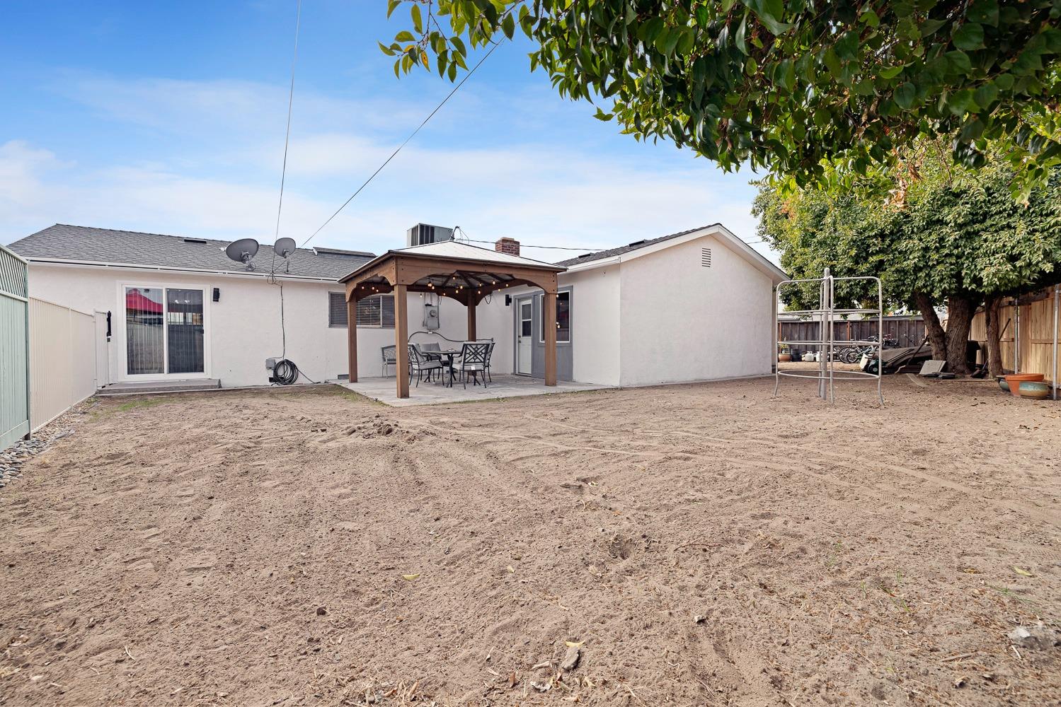 2637 Dewitt Avenue Clovis, CA 93612 - Photo 21 of 25 a view of a house with a snow in the yard