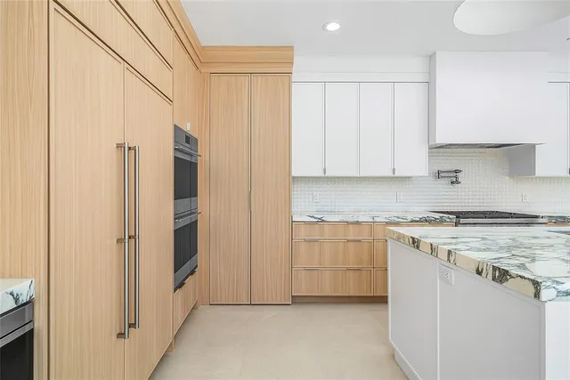 a bathroom with a sink a vanity and a mirror