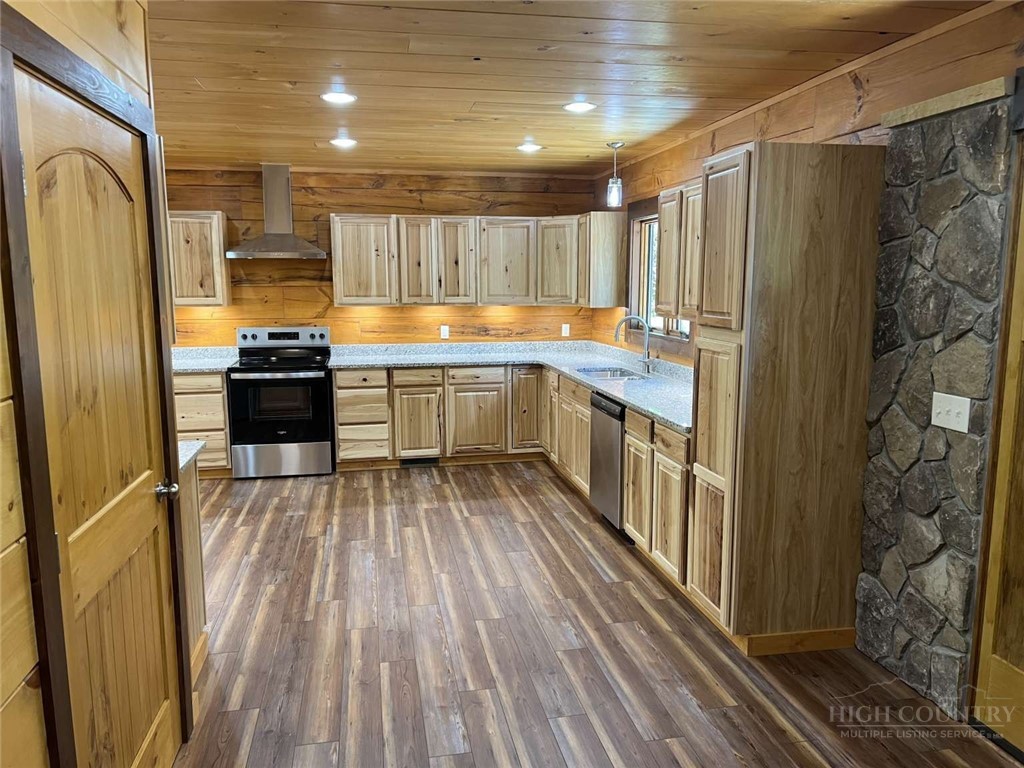 138 Talon Drive Boone, NC 28607 - Photo 8 of 25 a kitchen with stainless steel appliances granite countertop a refrigerator and a stove