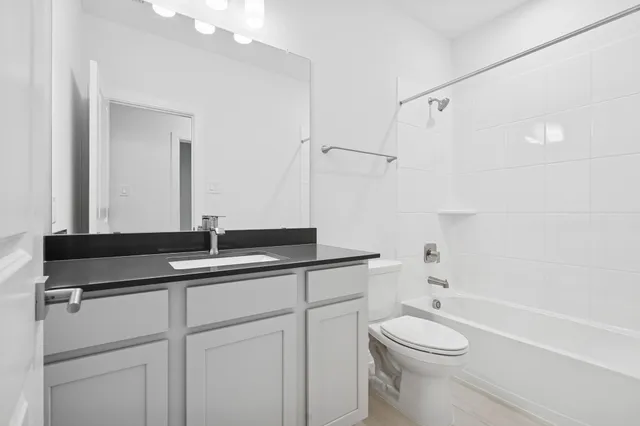 a kitchen with stainless steel appliances sink stove refrigerator and cabinets