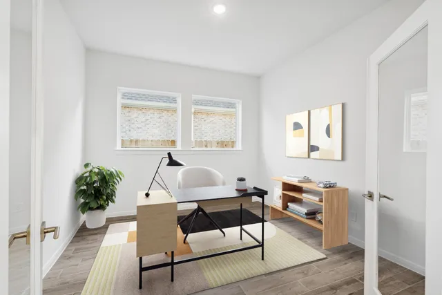 a workspace with furniture and a potted plant
