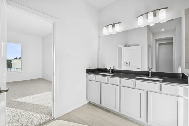 a bathroom with a shower and a mirror