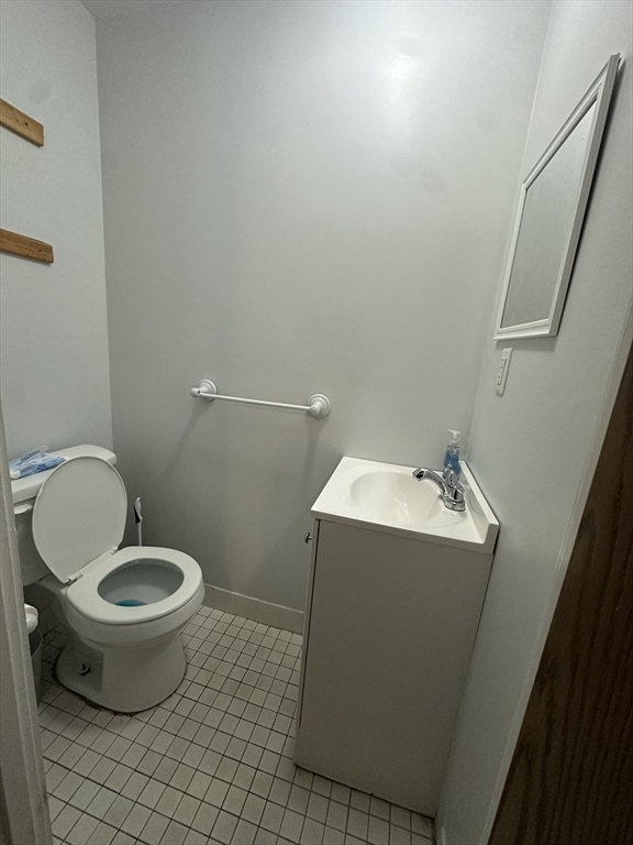 605 Eastern Avenue, Unit 211 Lynn, MA 01902 - Photo 11 of 29 a bathroom with a toilet and a sink