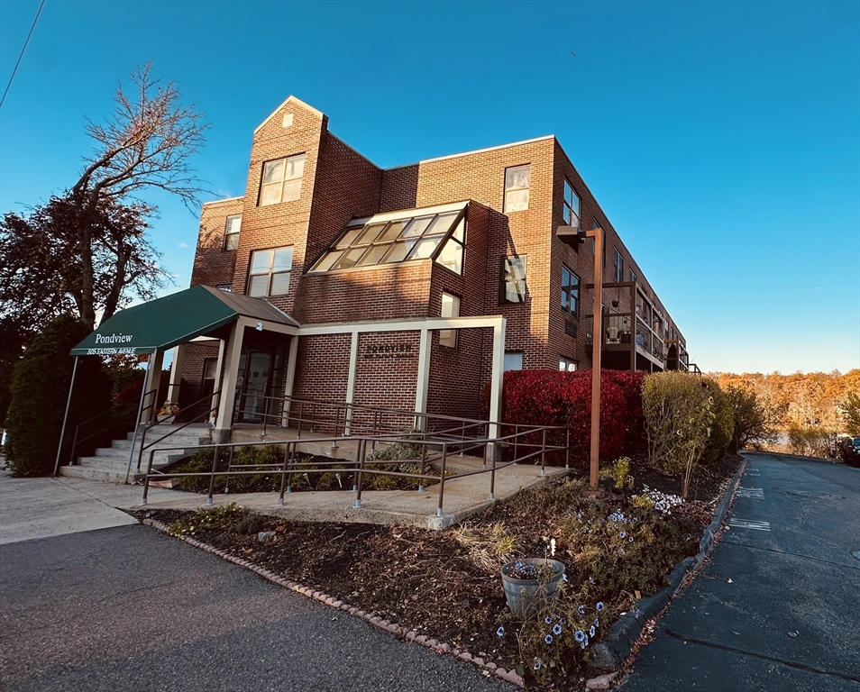 605 Eastern Avenue, Unit 211 Lynn, MA 01902 - Photo 2 of 29 front view of a house with a small yard