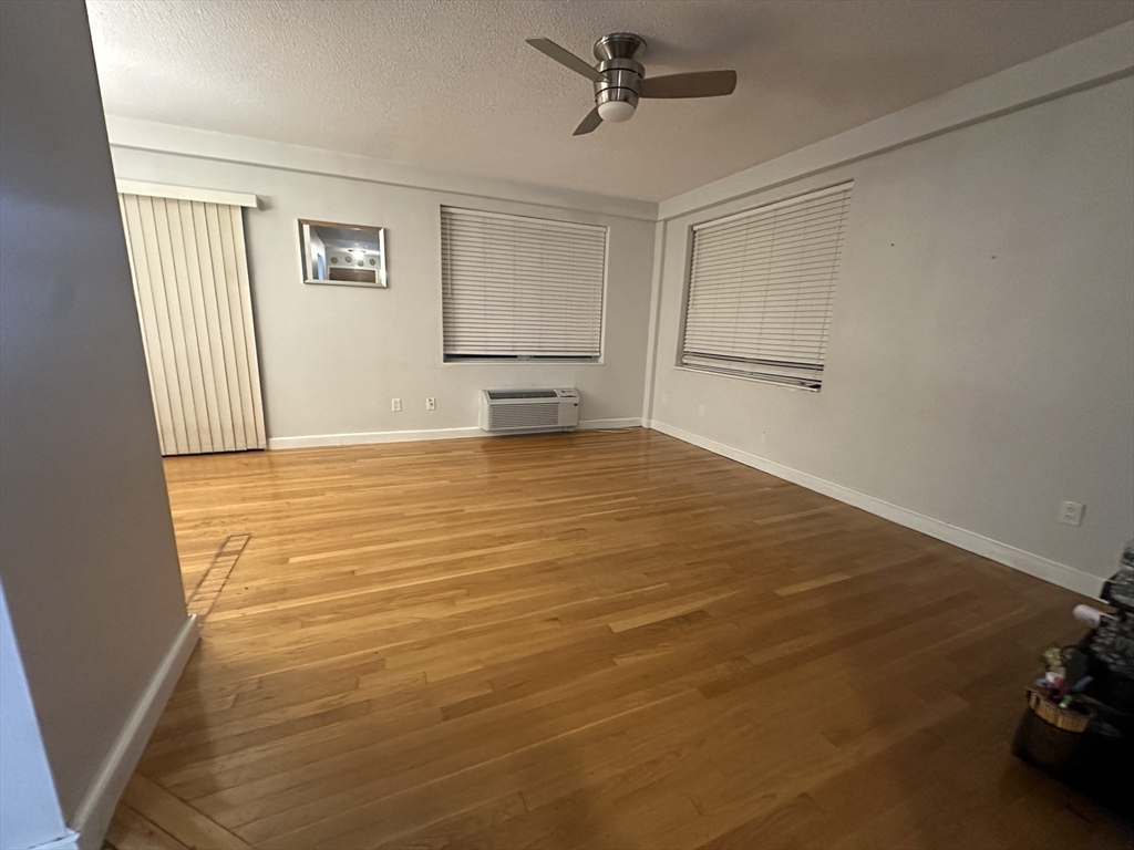 605 Eastern Avenue, Unit 211 Lynn, MA 01902 - Photo 8 of 29 a view of an empty room with a window