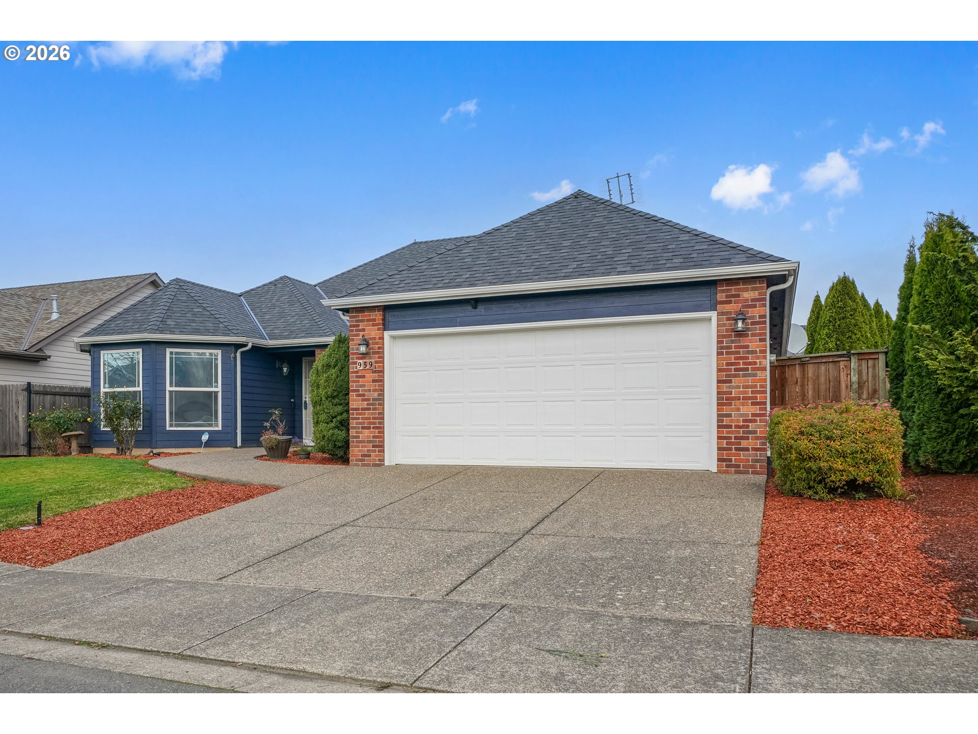 959 Stonebridge Avenue Northeast Keizer, OR 97303 - Photo 12 of 48 a front view of a house with a yard and garage