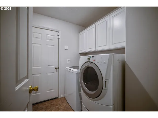 a view of a kitchen with cabinets