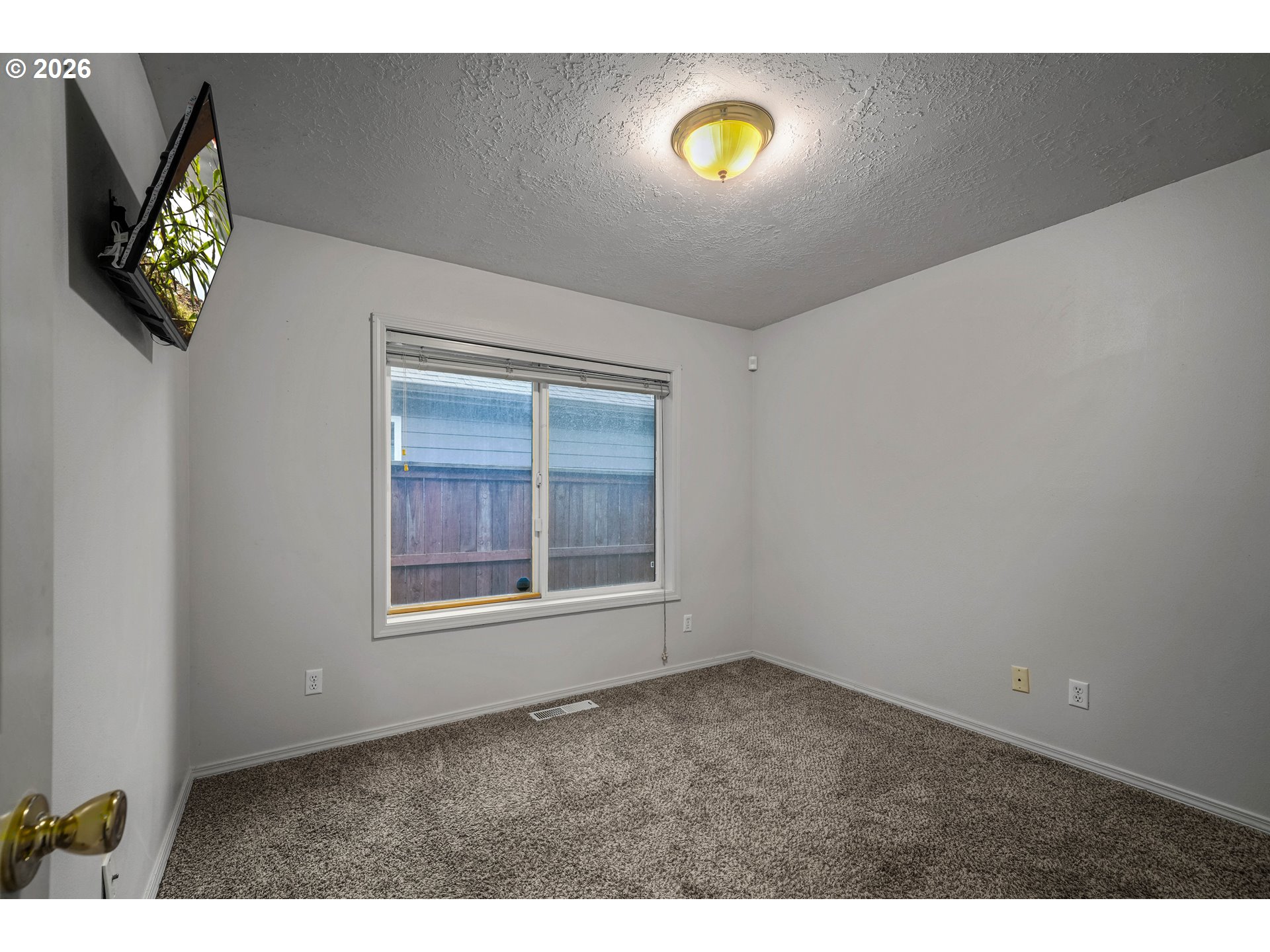 959 Stonebridge Avenue Northeast Keizer, OR 97303 - Photo 18 of 48 a view of an empty room with a window