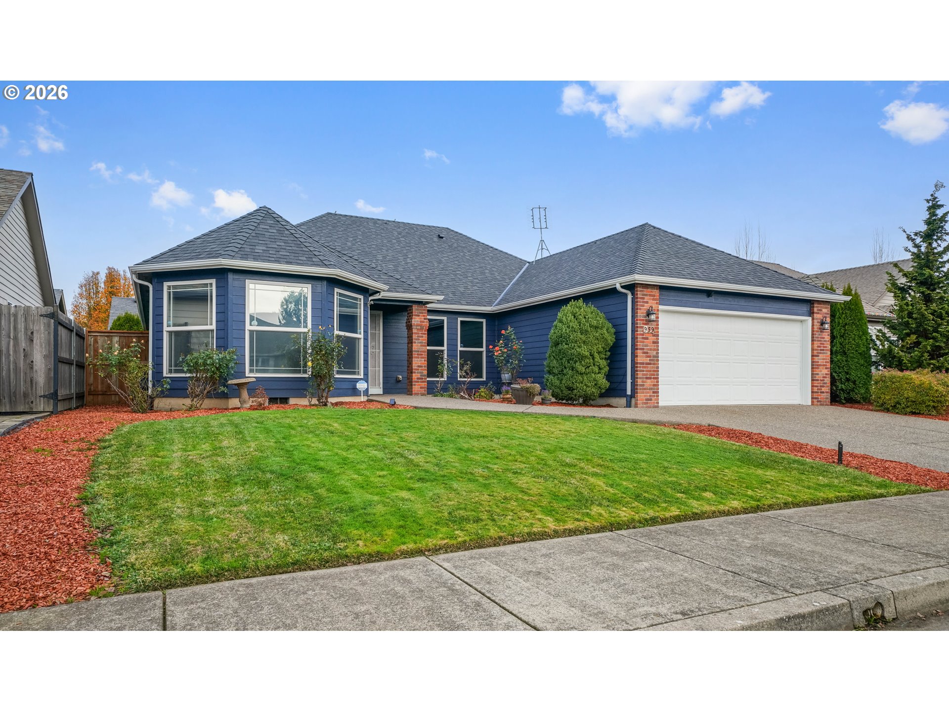 959 Stonebridge Avenue Northeast Keizer, OR 97303 - Photo 25 of 48 a front view of a house with a garden and yard