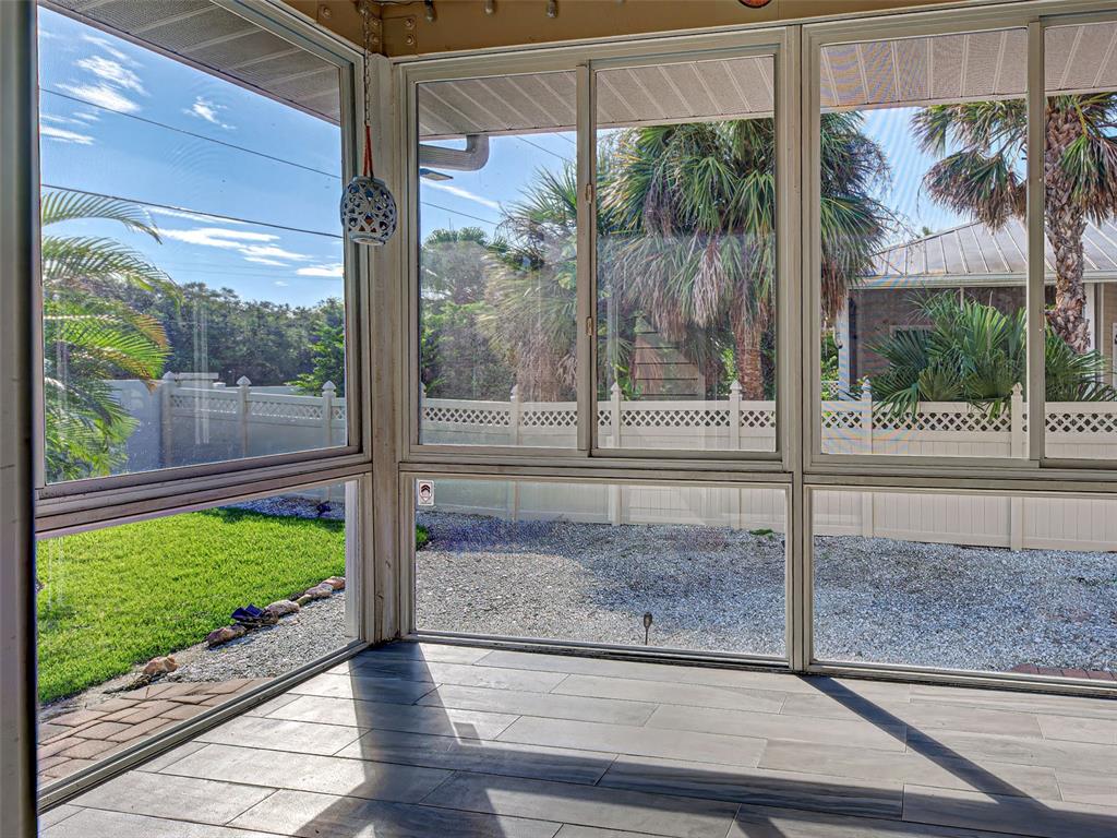 1801 Highland Road Osprey, FL 34229 - Photo 32 of 40 a view of a room with a floor to ceiling window