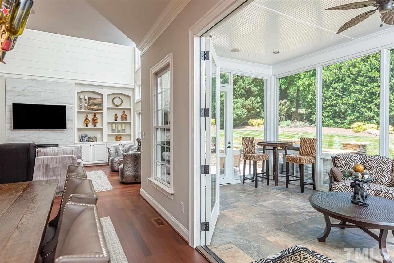 2024 Macon Ridge Road Raleigh, NC 27613 - Photo 13 of 30 Easy Breeze windows and electric fireplace makes this room comfortable in 4 seasons. Windows are awesome during pollen season