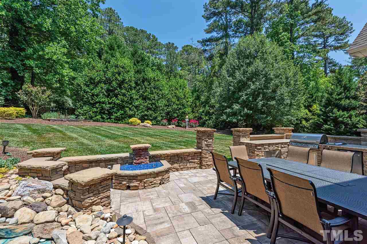 2024 Macon Ridge Road Raleigh, NC 27613 - Photo 16 of 30 Firepit, relaxing pond, kitchen grill station and landscape lighting is picture perfect for outdoor entertaining