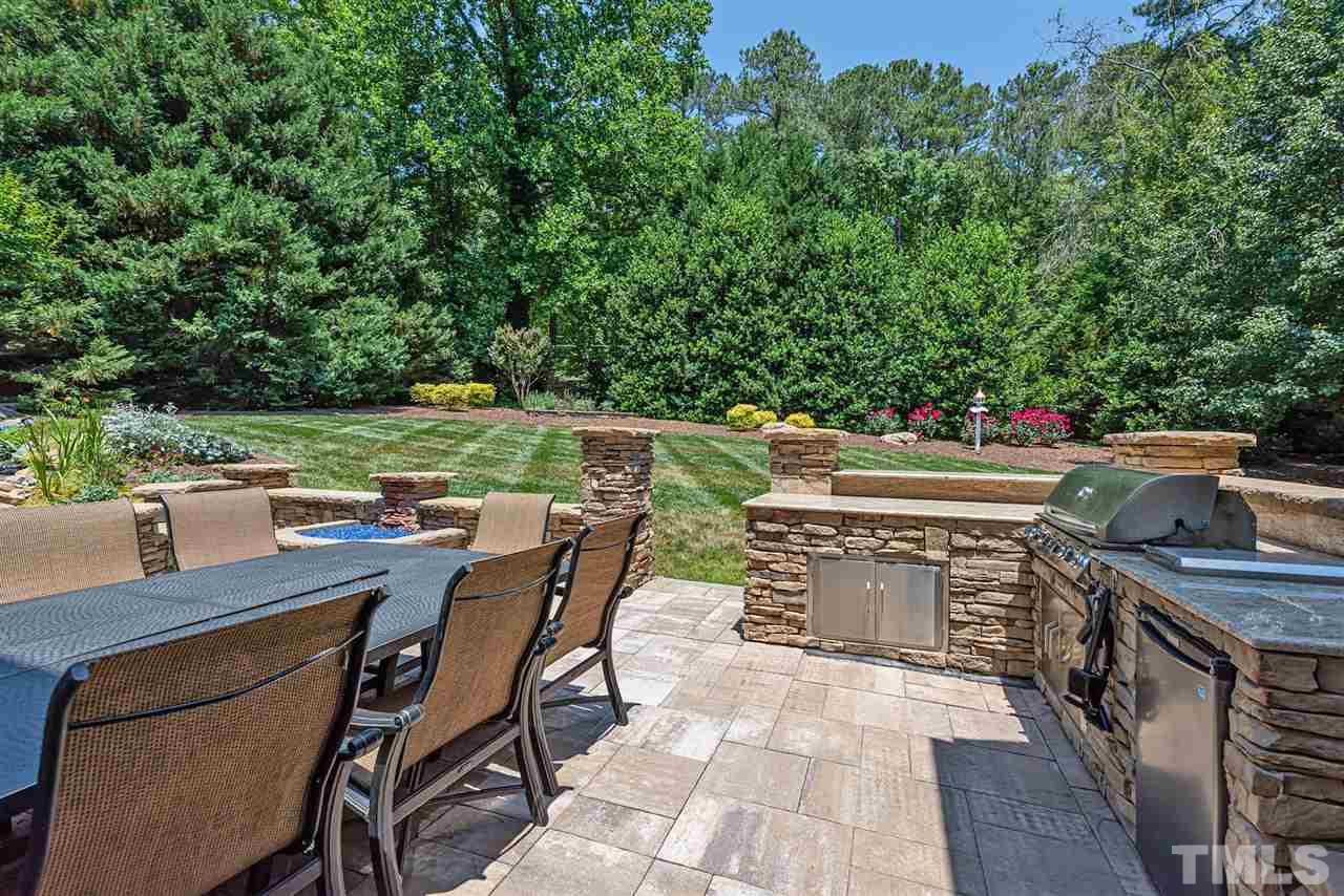 2024 Macon Ridge Road Raleigh, NC 27613 - Photo 17 of 30 Patio table with gas log fire strip and chairs for sale