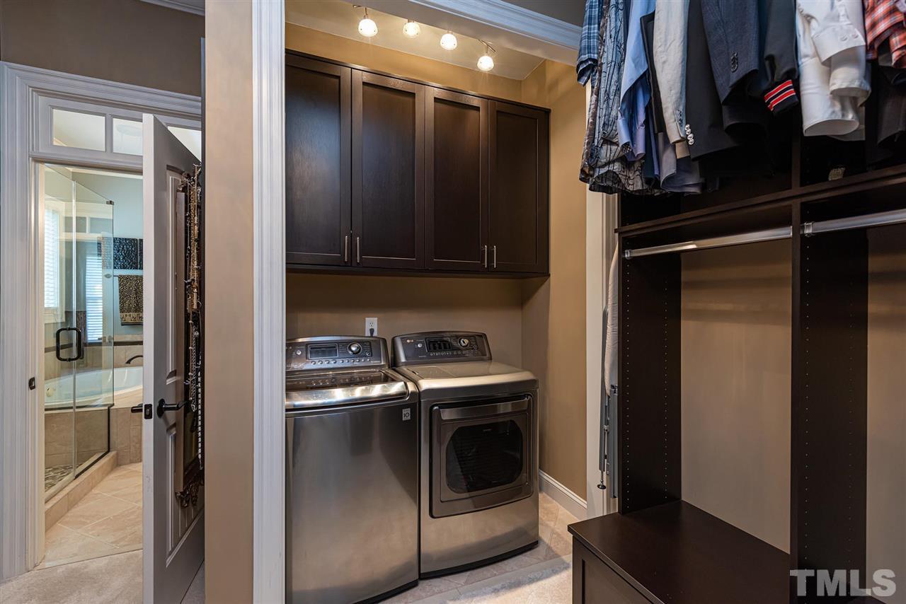 2024 Macon Ridge Road Raleigh, NC 27613 - Photo 23 of 30 First floor washer and dryer located in custom walk in closet. Second floor laundry too.