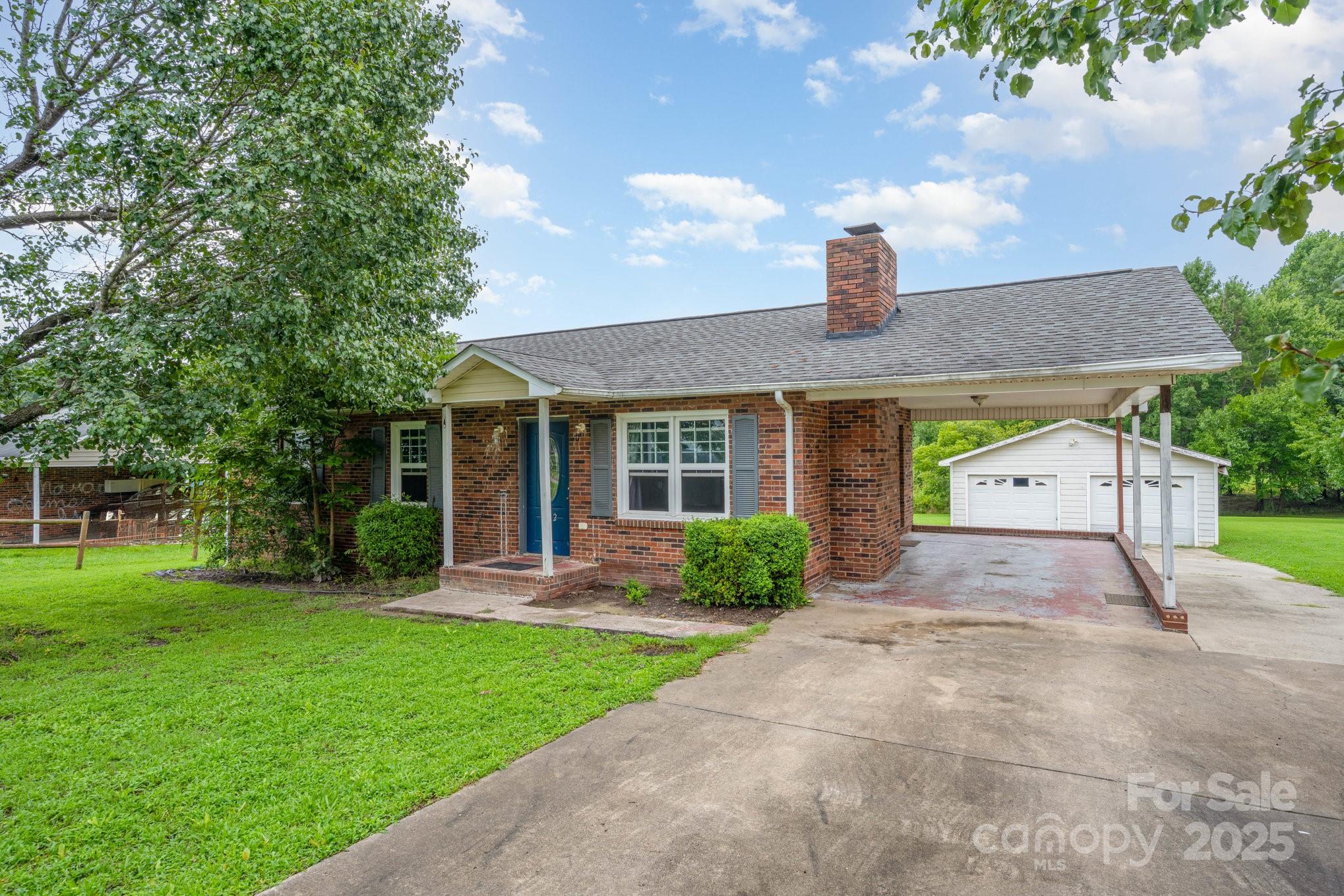 132 Hicks Road Grover, NC 28073 - Photo 2 of 31 a front view of a house with garden