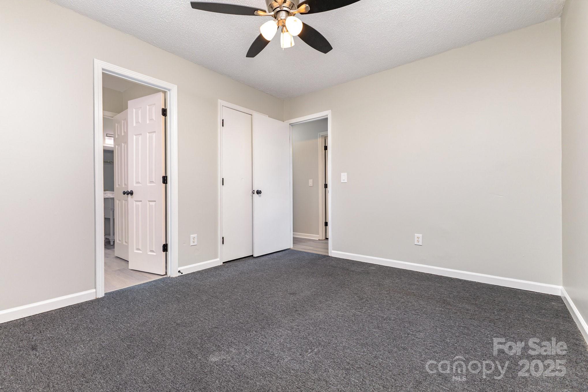 132 Hicks Road Grover, NC 28073 - Photo 24 of 31 an empty room with a ceiling fan and a window