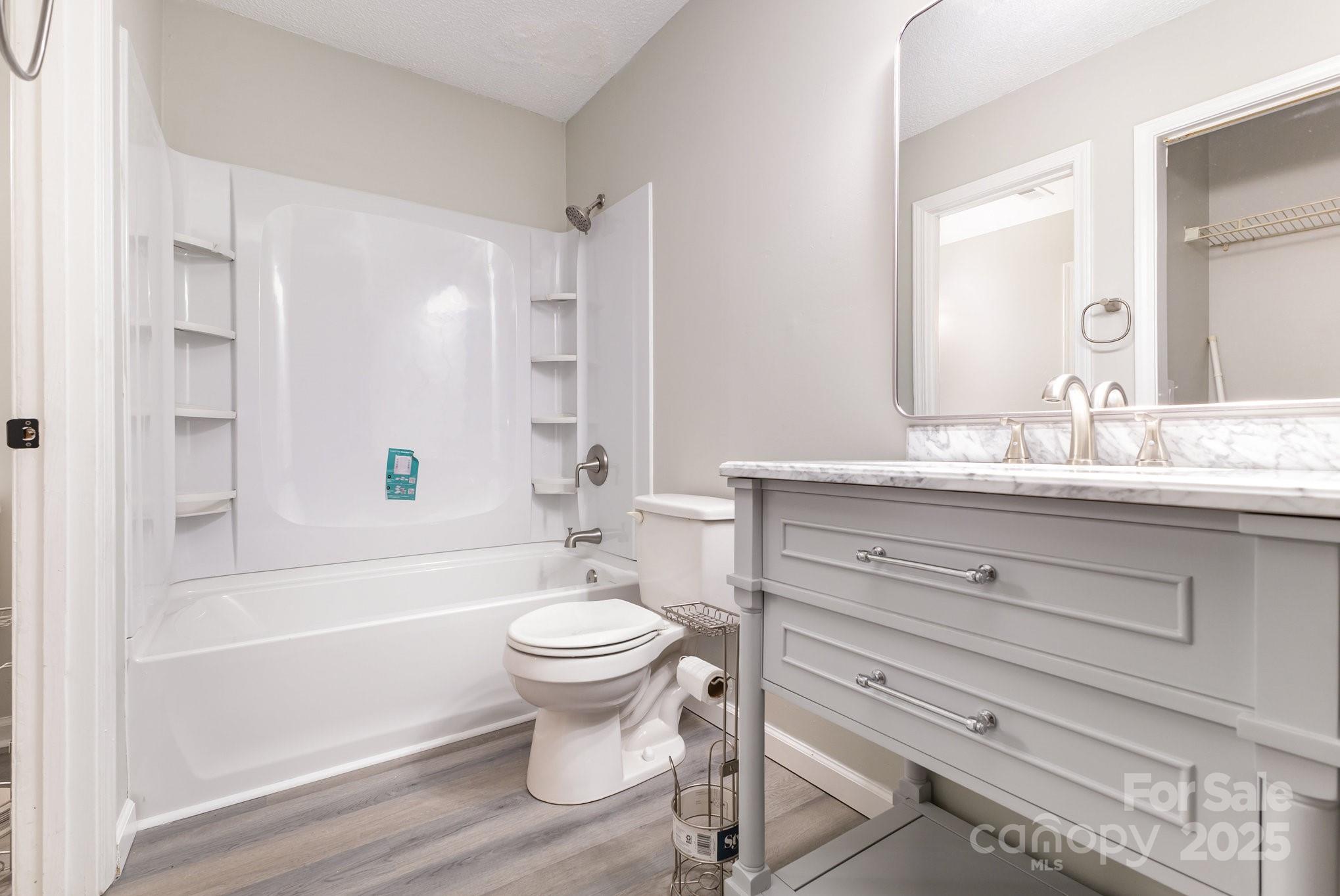 132 Hicks Road Grover, NC 28073 - Photo 25 of 31 a bathroom with a sink toilet a mirror and bathtub