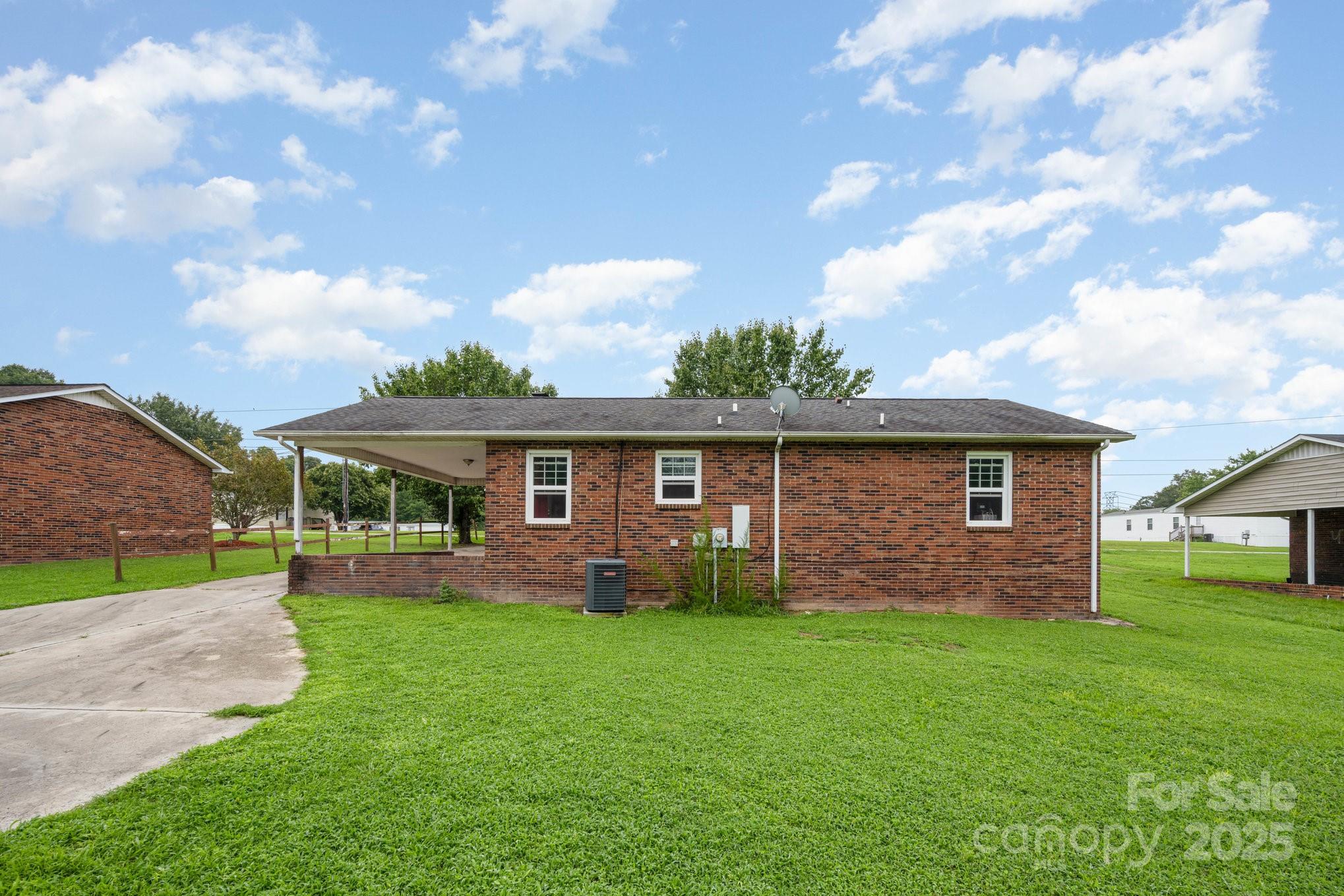132 Hicks Road Grover, NC 28073 - Photo 5 of 31 a view of a yard in front of a house with large tree