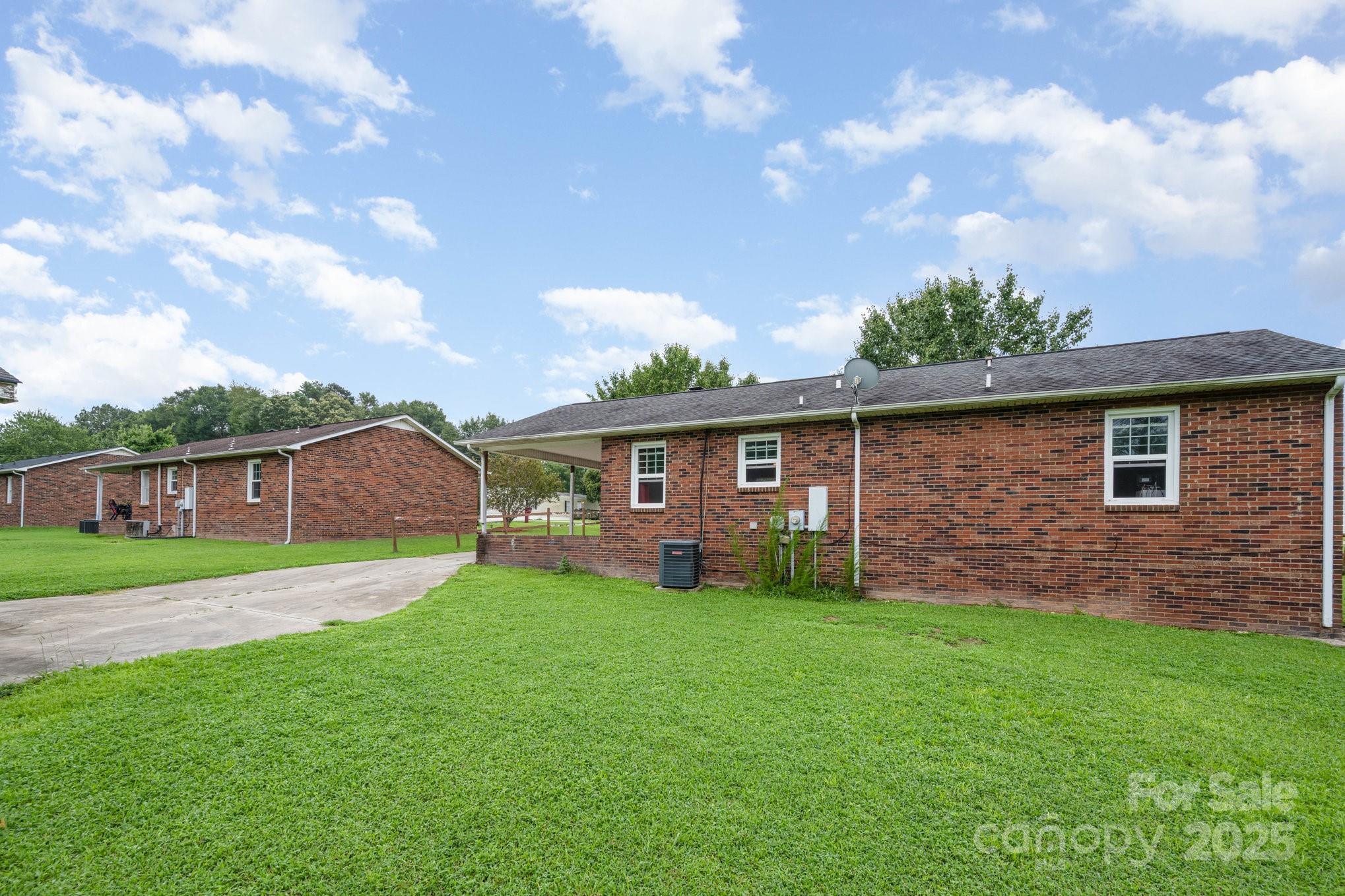 132 Hicks Road Grover, NC 28073 - Photo 6 of 31 a view of a yard in front of a house with large tree