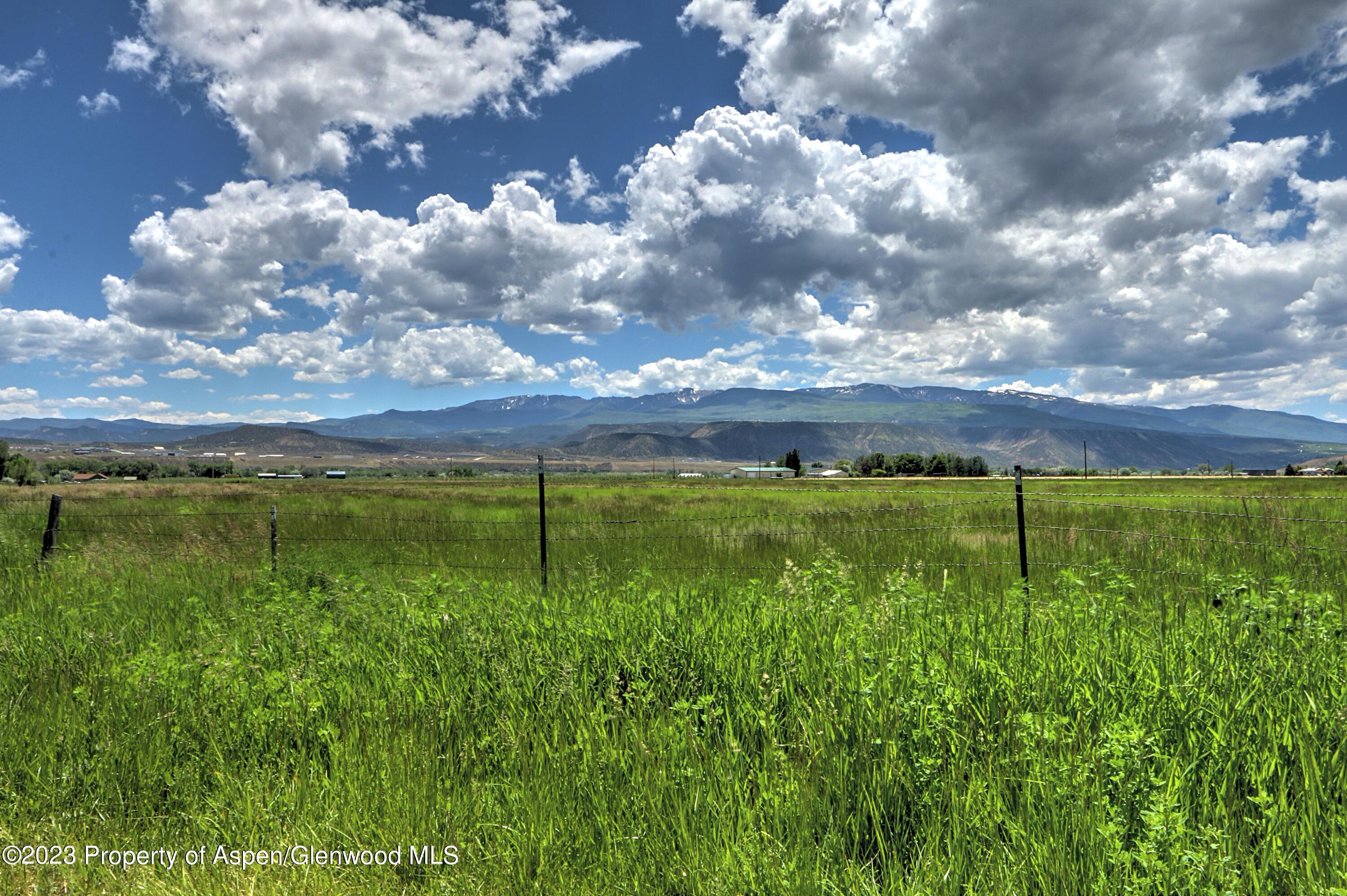 2517 210 County Road Rifle, CO 81650 - Photo 1 of 41 a view of a city with lush green forest