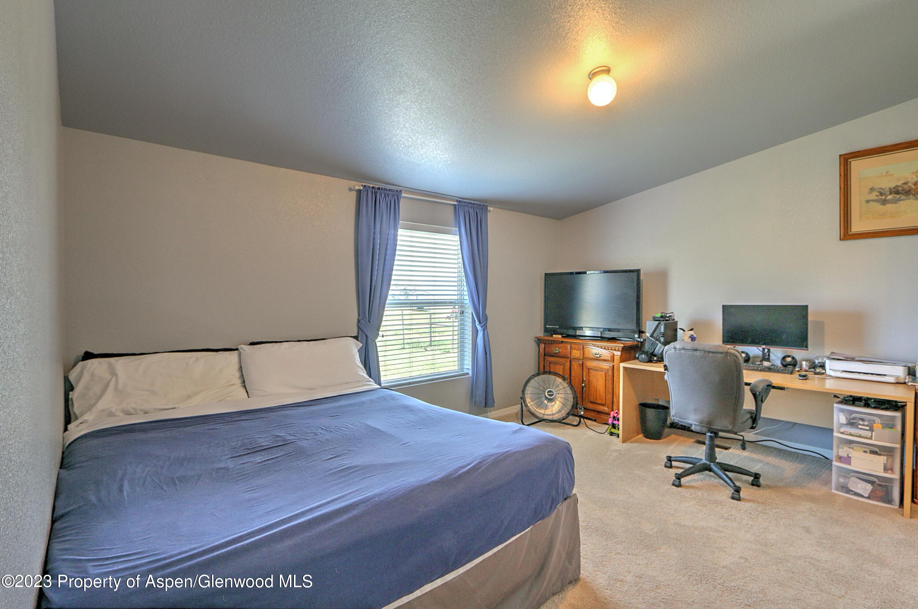 2517 210 County Road Rifle, CO 81650 - Photo 17 of 41 a bedroom with a workspace