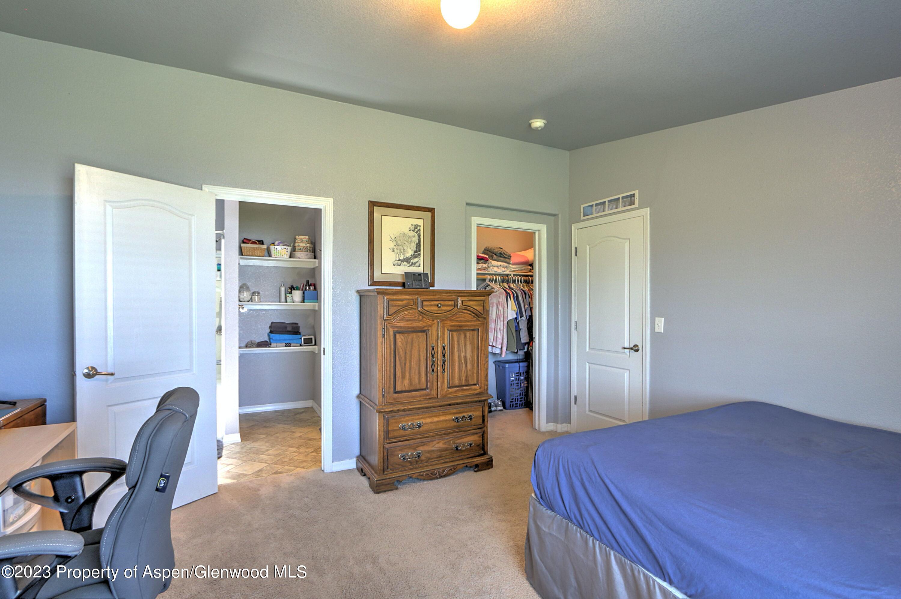 2517 210 County Road Rifle, CO 81650 - Photo 18 of 41 a bedroom with a bed and furniture