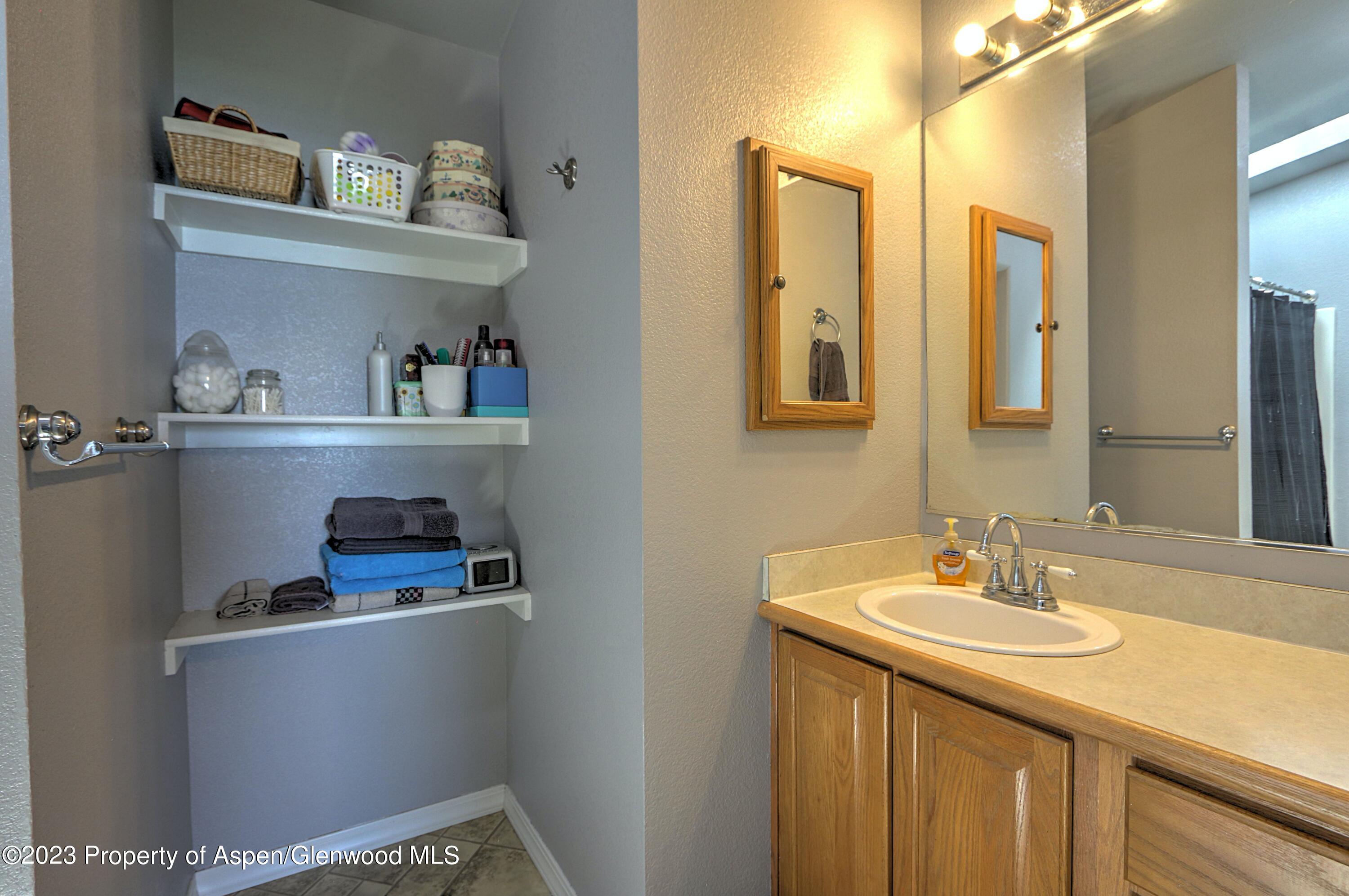 2517 210 County Road Rifle, CO 81650 - Photo 20 of 41 a bathroom with a sink and a mirror