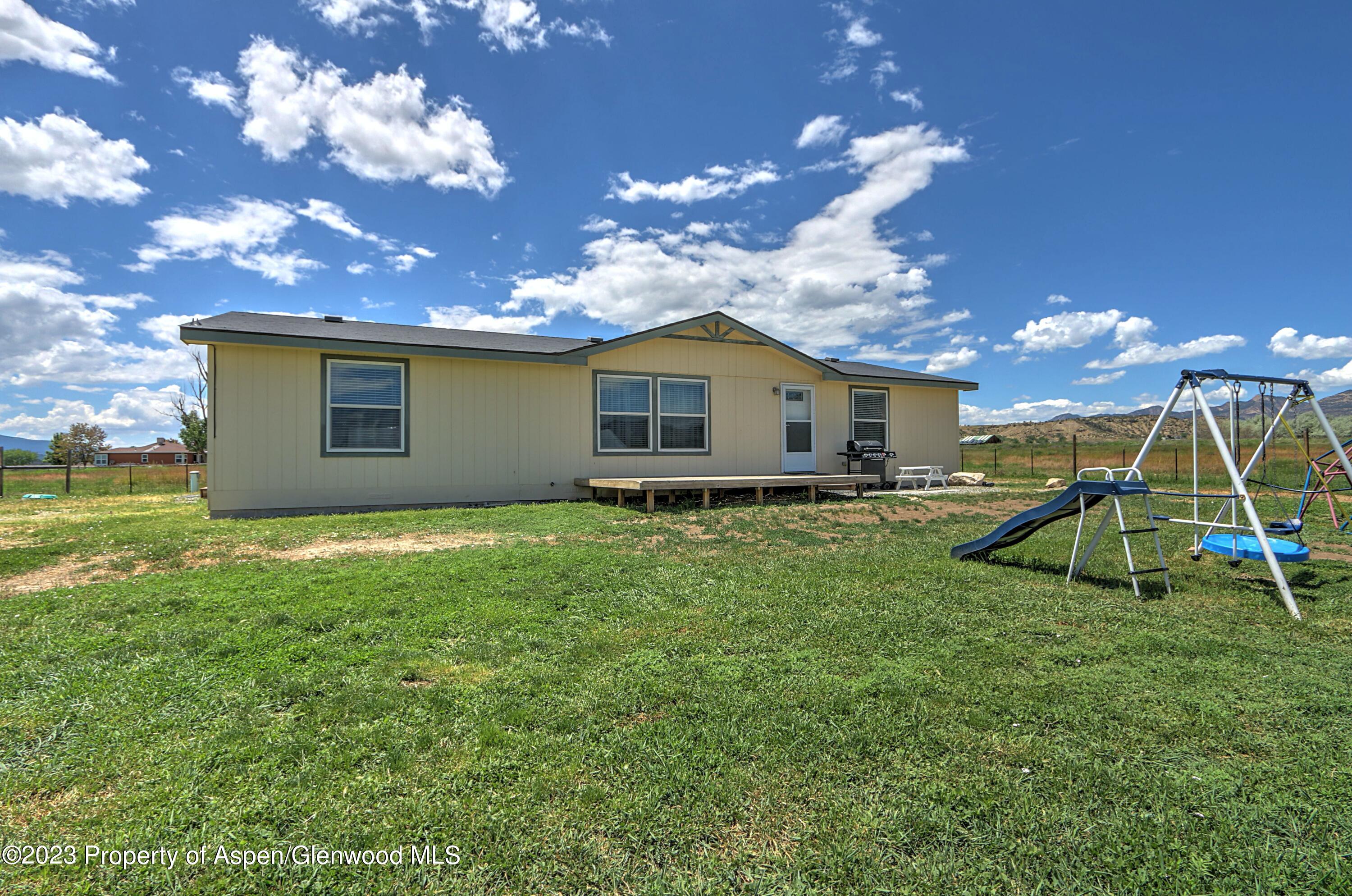 2517 210 County Road Rifle, CO 81650 - Photo 5 of 41 a view of a house with a backyard