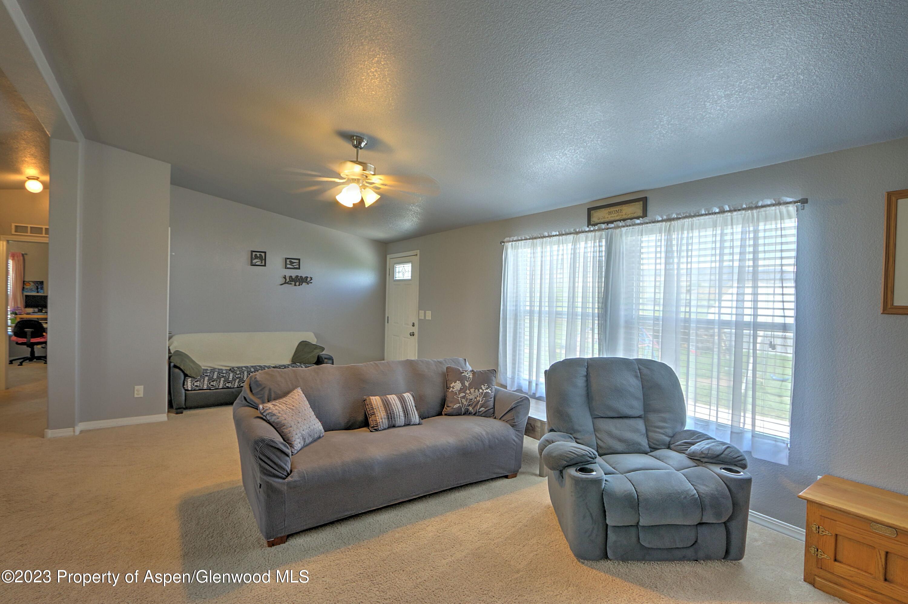2517 210 County Road Rifle, CO 81650 - Photo 8 of 41 a living room with furniture and a large window