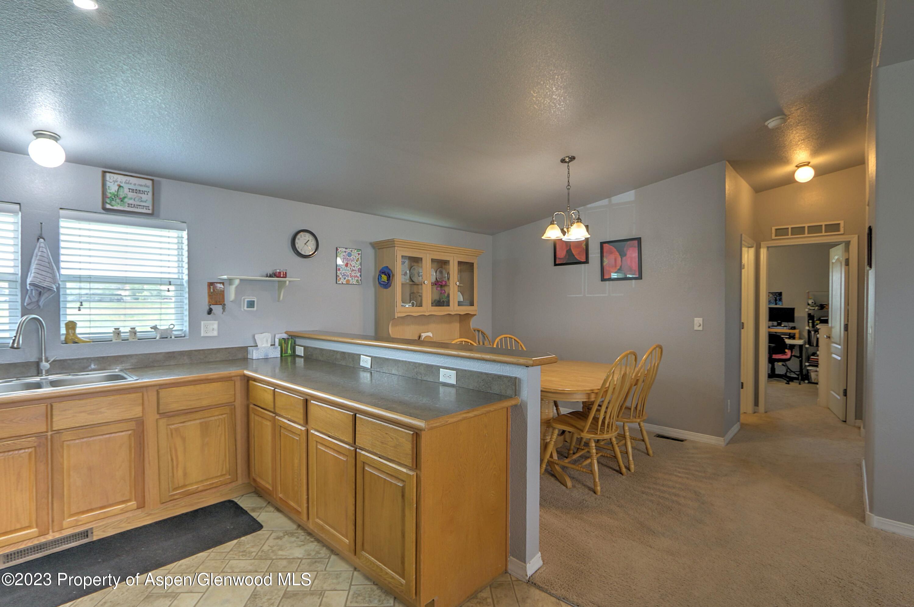 2517 210 County Road Rifle, CO 81650 - Photo 9 of 41 a kitchen with a sink and cabinets