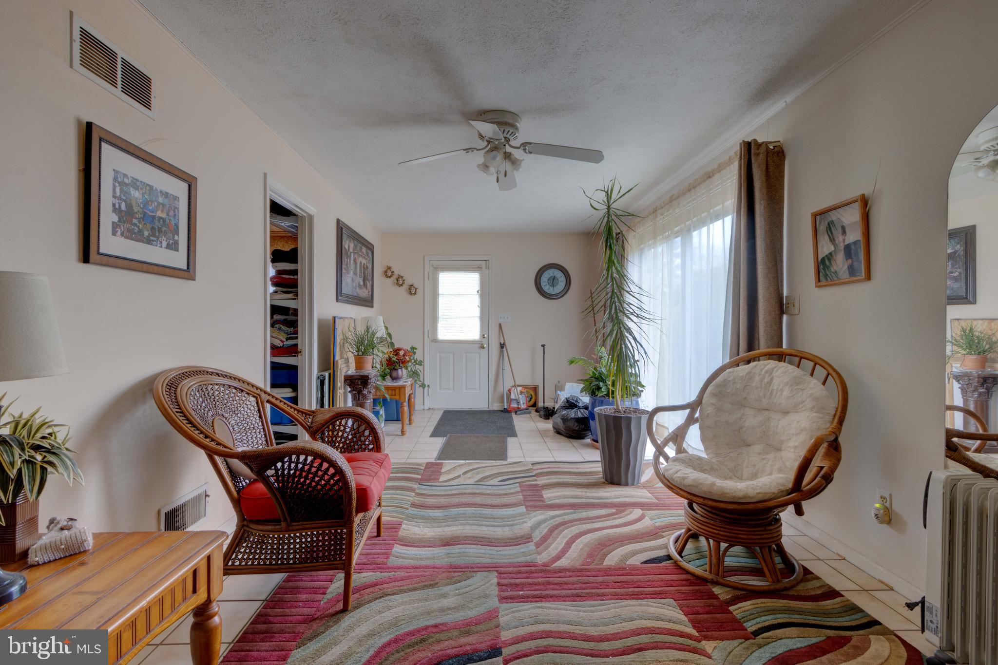 205 Glenville Road Churchville, MD 21028 - Photo 12 of 25 a view of a livingroom with furniture and a potted plant