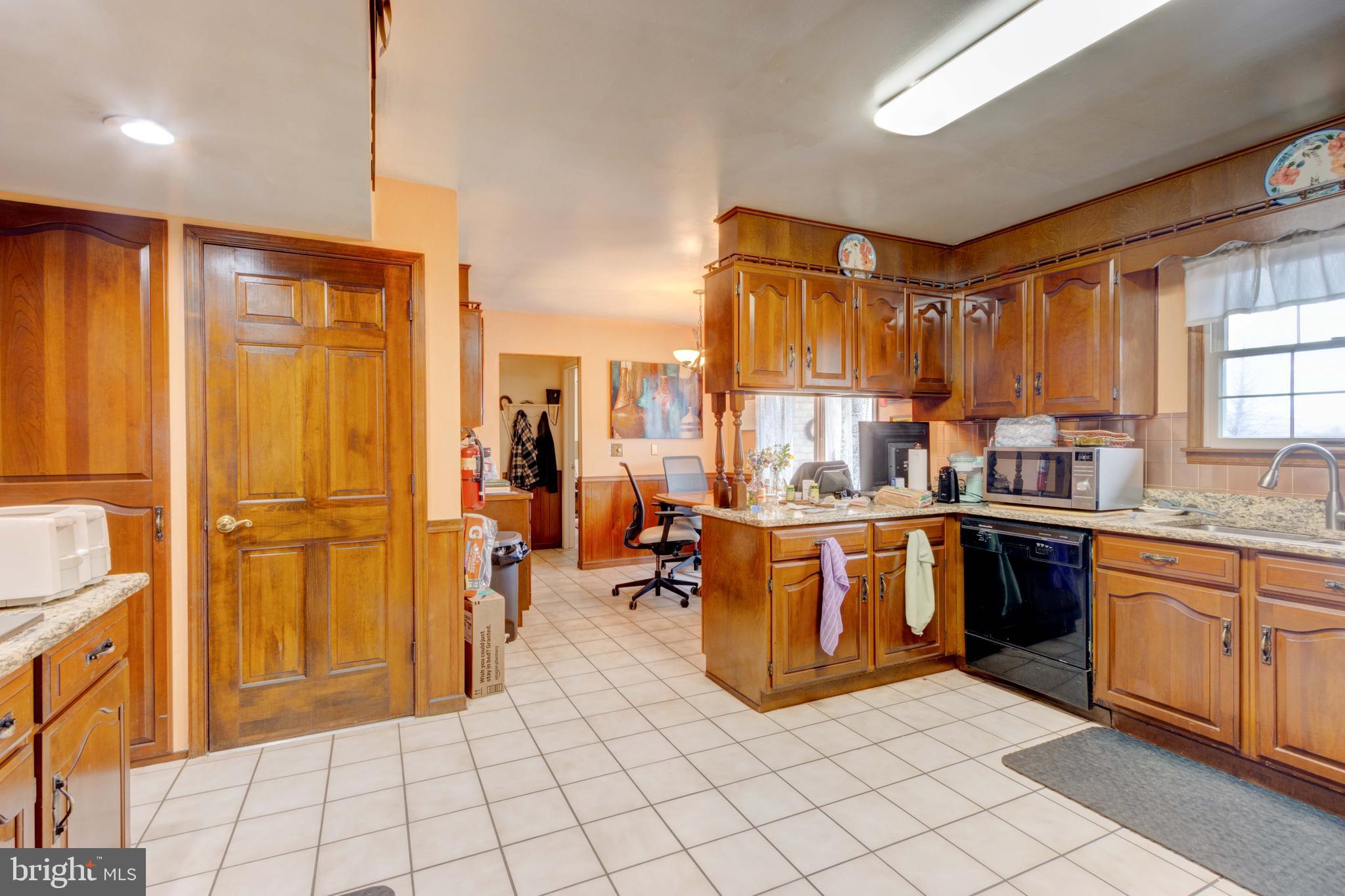 205 Glenville Road Churchville, MD 21028 - Photo 6 of 25 a kitchen with stainless steel appliances granite countertop a refrigerator and a sink