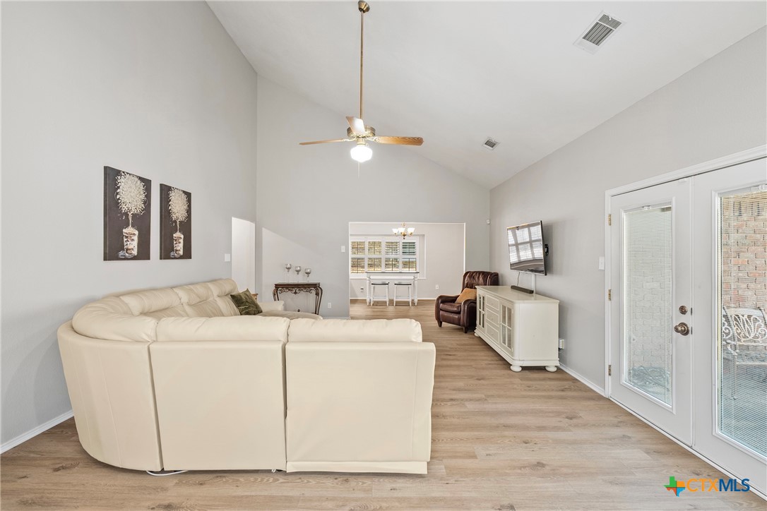 4518 Stagecoach Trail Temple, TX 76502 - Photo 14 of 29 a living room with furniture and a wooden floor