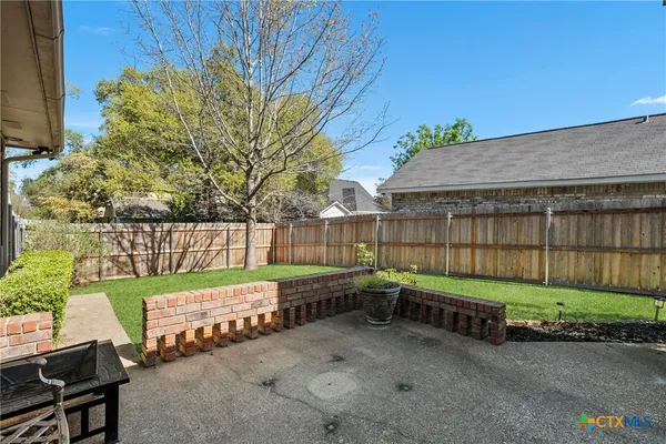 a garden view with a seating space