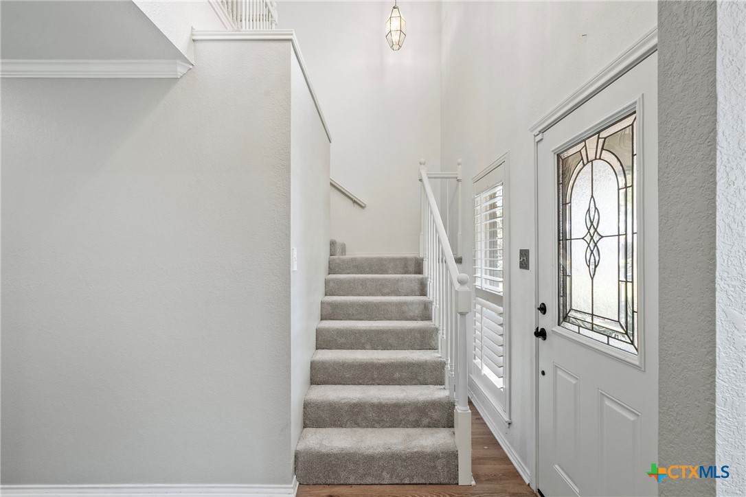 4518 Stagecoach Trail Temple, TX 76502 - Photo 4 of 29 a view of staircase with white walls and windows