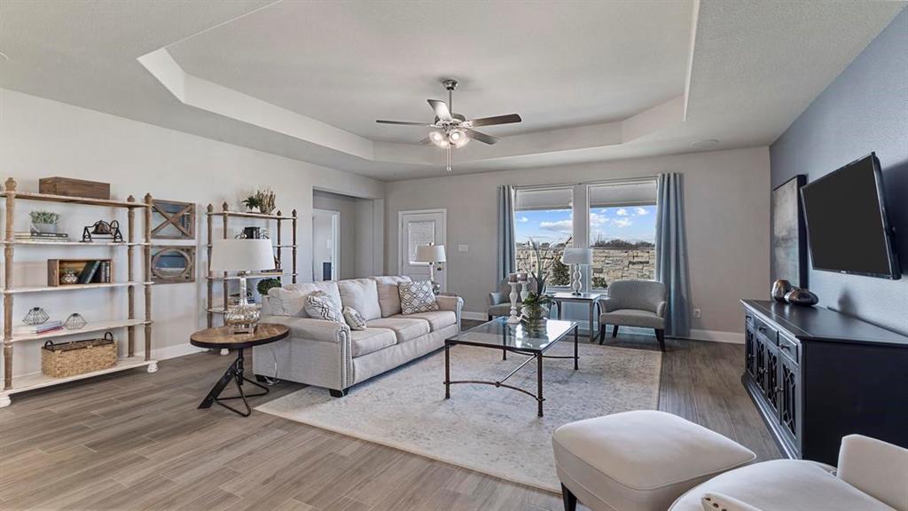 11205 Treehouse Trail Justin, TX 76247 - Photo 12 of 39 a living room with furniture and a flat screen tv