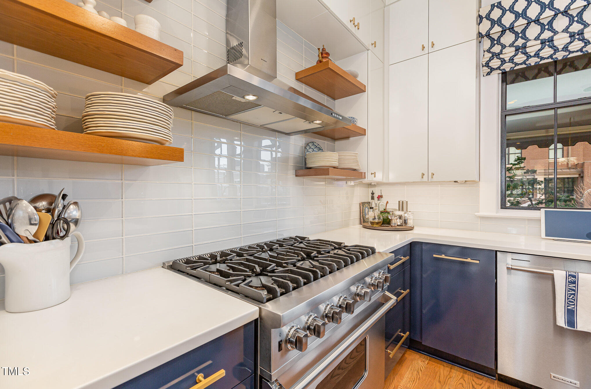 117 South Bloodworth Street Raleigh, NC 27601 - Photo 13 of 36 a kitchen with a stove and a sink
