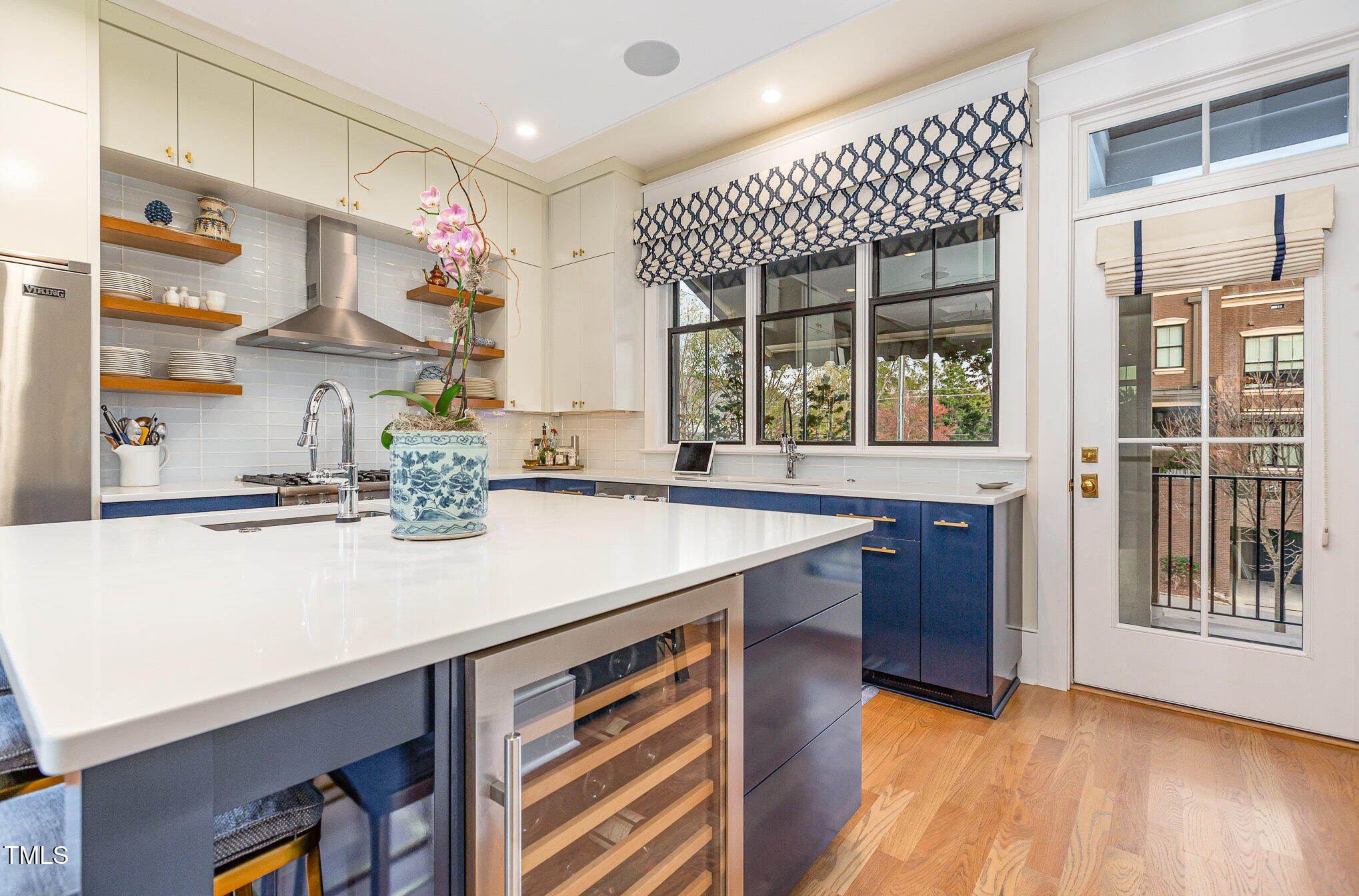 117 South Bloodworth Street Raleigh, NC 27601 - Photo 14 of 36 a kitchen with a sink a stove and a wooden floor