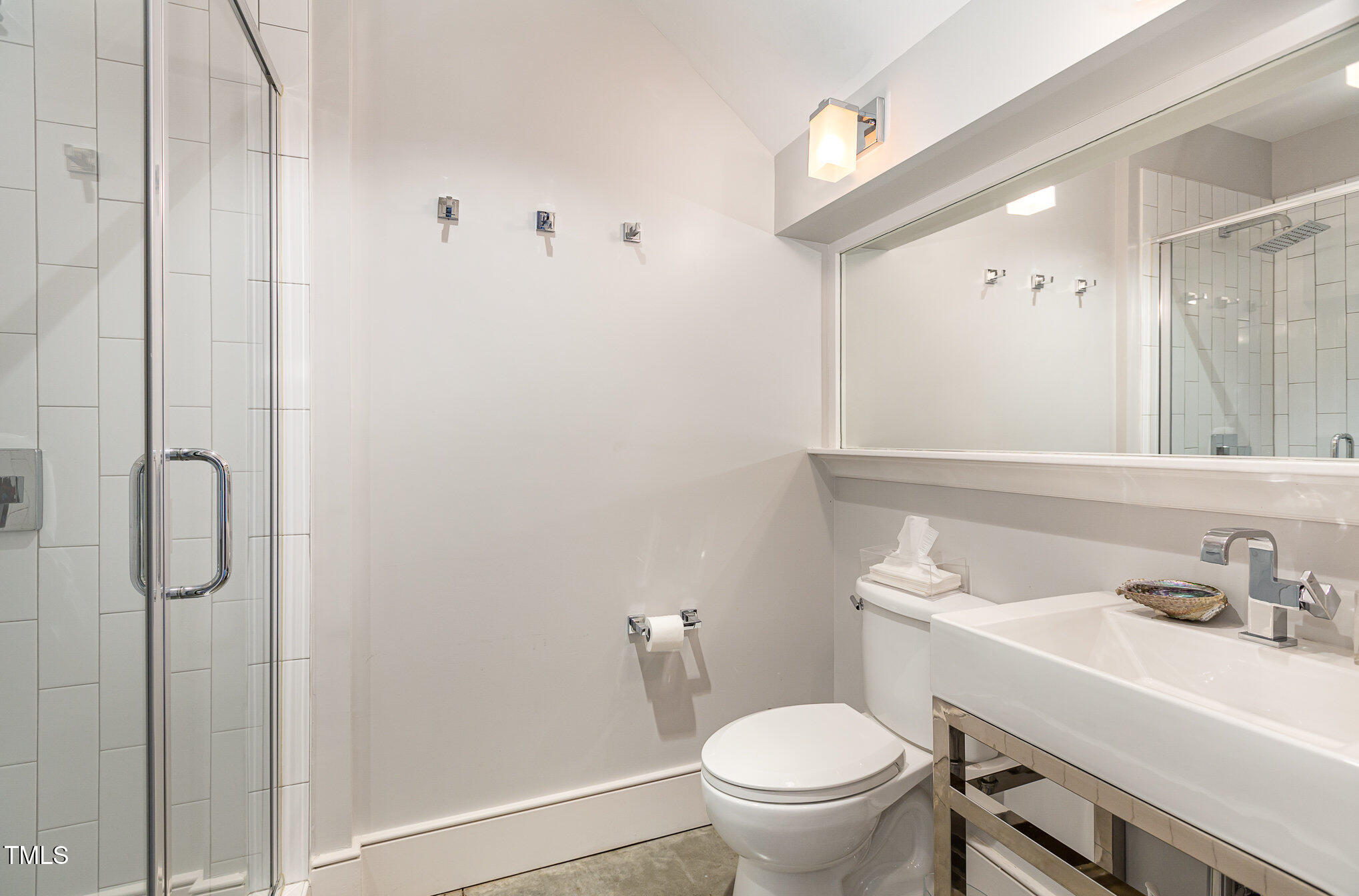 117 South Bloodworth Street Raleigh, NC 27601 - Photo 26 of 36 a bathroom with a toilet sink and shower