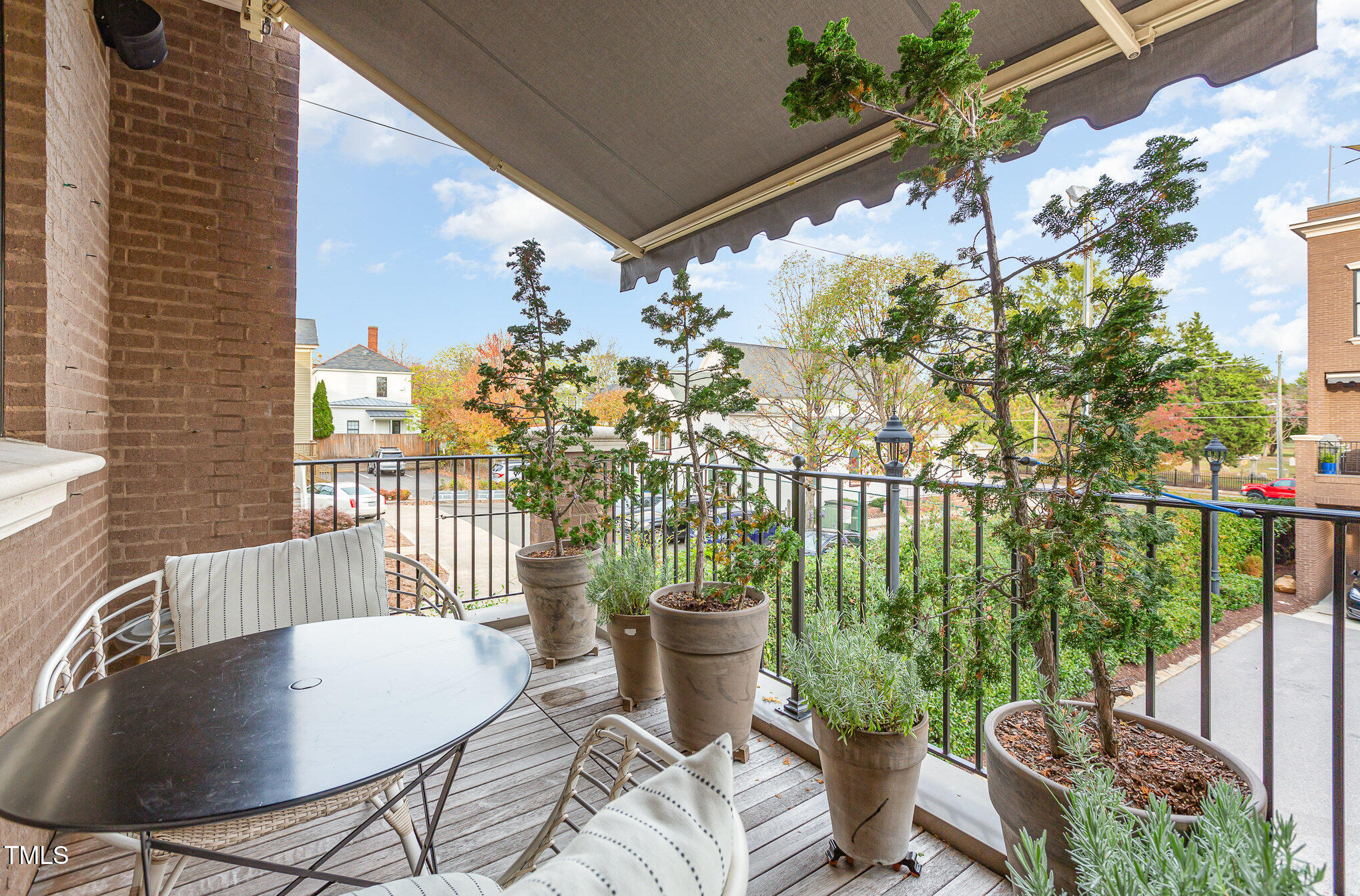 117 South Bloodworth Street Raleigh, NC 27601 - Photo 28 of 36 a view of a balcony with chairs and a potted plant
