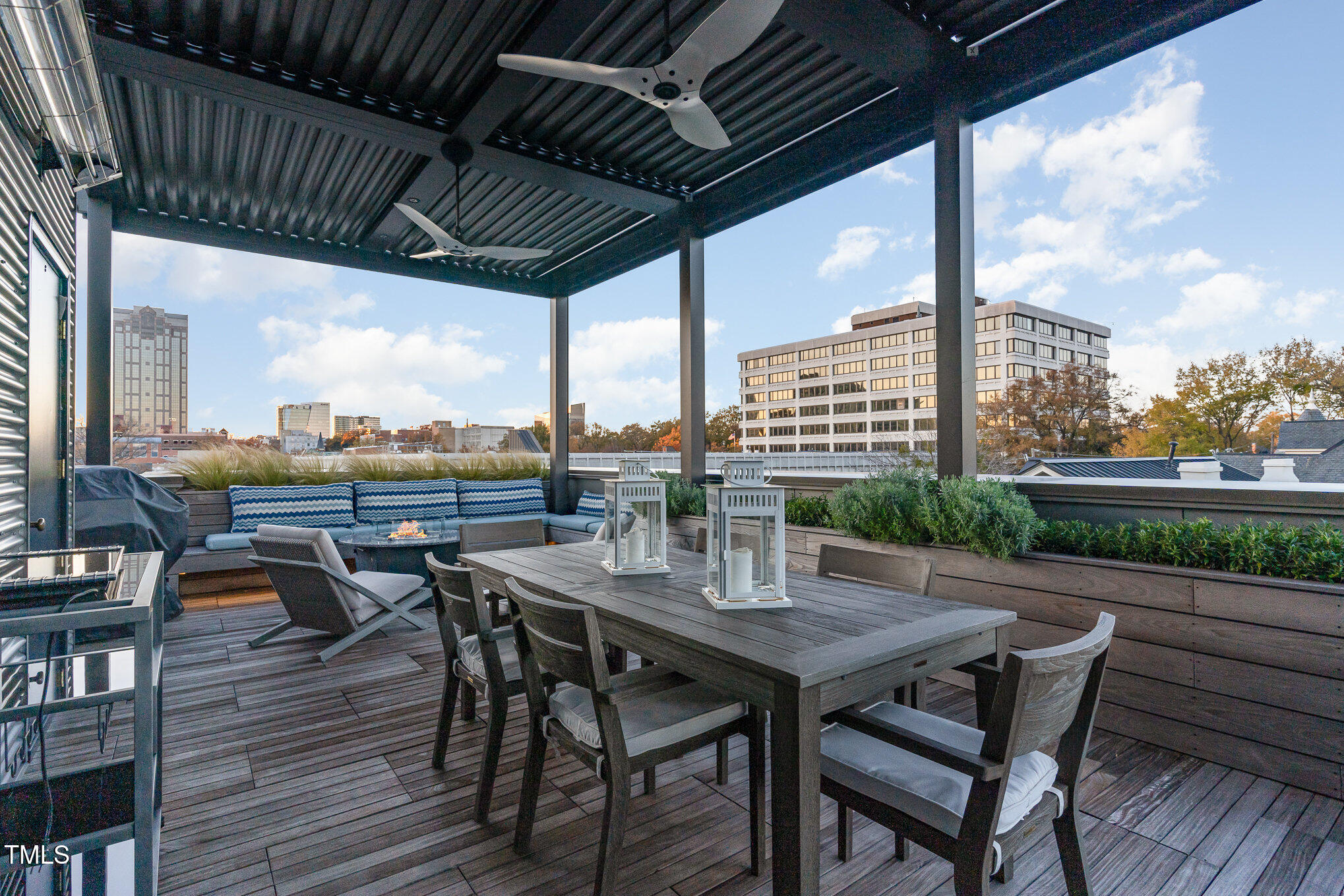 117 South Bloodworth Street Raleigh, NC 27601 - Photo 35 of 36 a patio with wooden floor a barbeque grill with dining table and chairs
