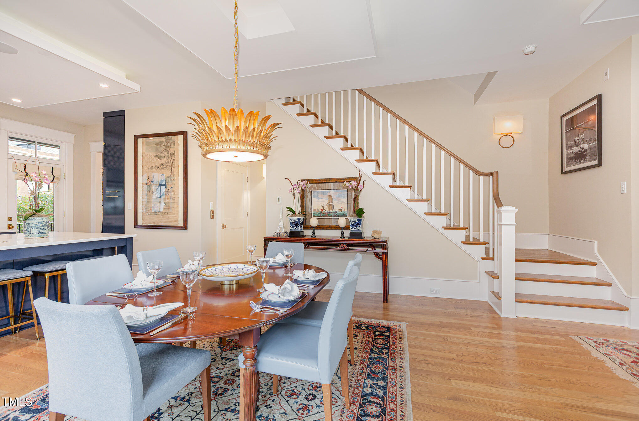 117 South Bloodworth Street Raleigh, NC 27601 - Photo 10 of 36 a dining room with furniture a rug and wooden floor