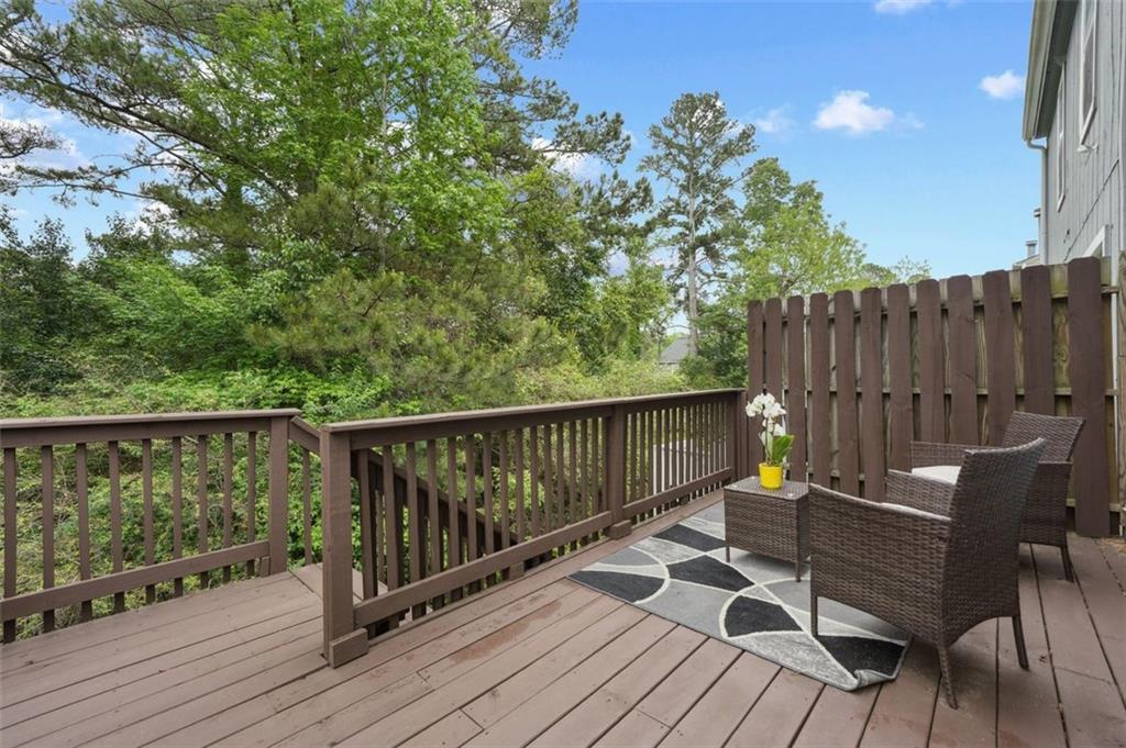 6420 Marbut Road Lithonia, GA 30058 - Photo 27 of 29 a view of a balcony with wooden floor and outdoor seating