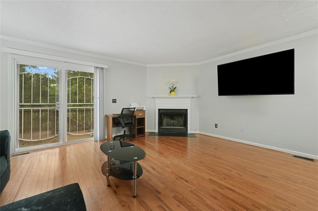 6420 Marbut Road Lithonia, GA 30058 - Photo 3 of 29 a living room with furniture and a flat screen tv