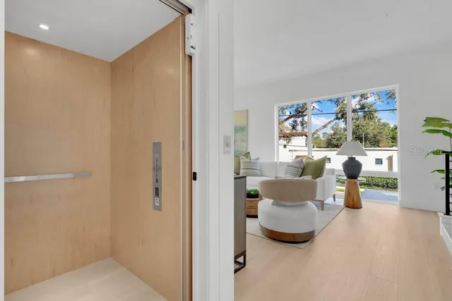 a front view of a building with plants