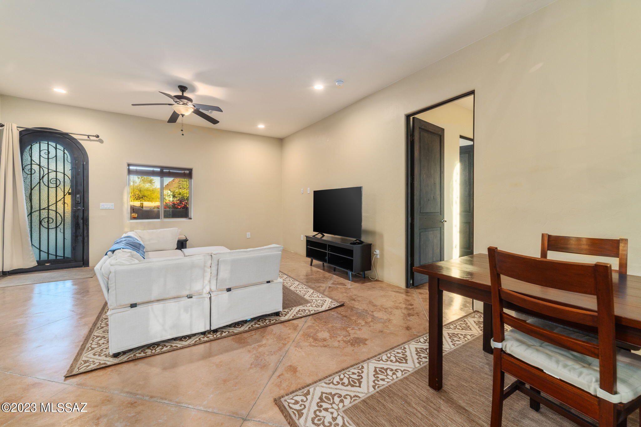 5670 Triangle X Place Tucson, AZ 85713 - Photo 27 of 36 a living room with furniture and a flat screen tv