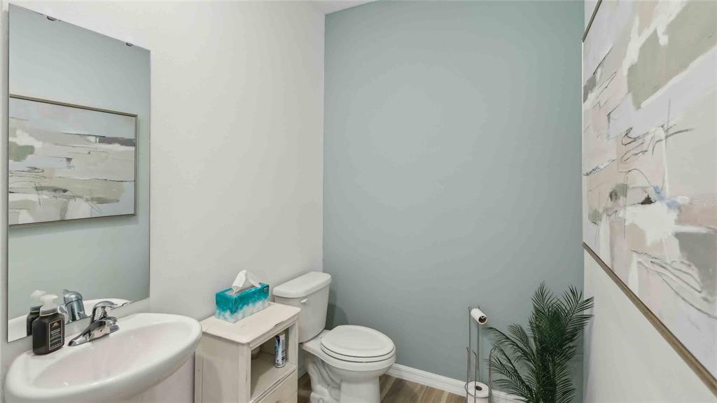 24478 Northwest 10th Road Newberry, FL 32669 - Photo 12 of 24 a bathroom with a sink toilet and a mirror