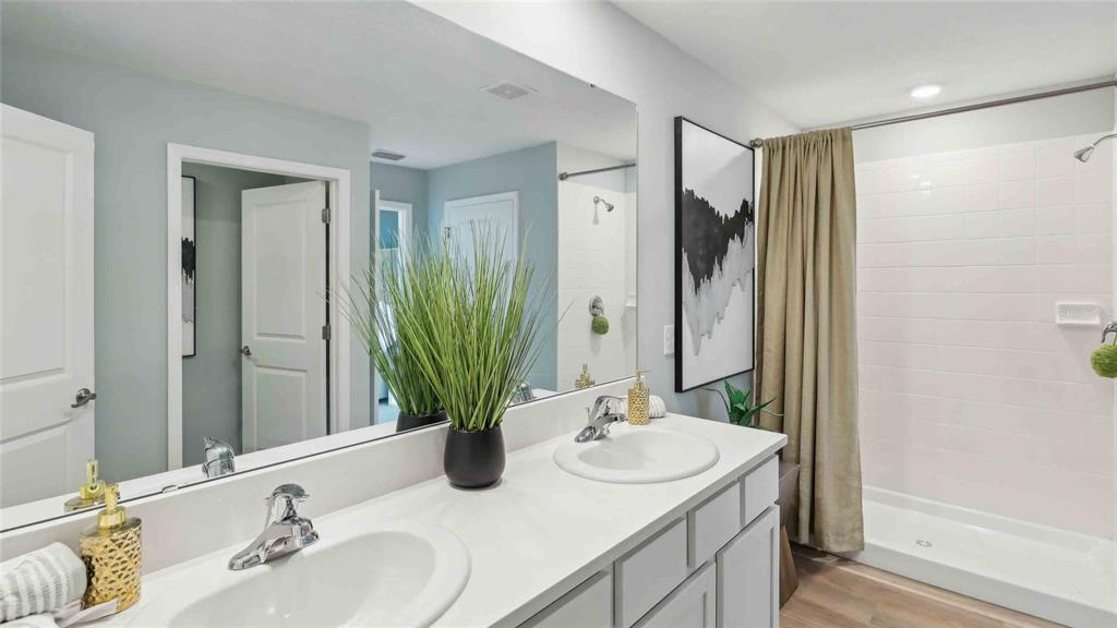 24478 Northwest 10th Road Newberry, FL 32669 - Photo 17 of 24 a bathroom with a granite countertop sink and a mirror