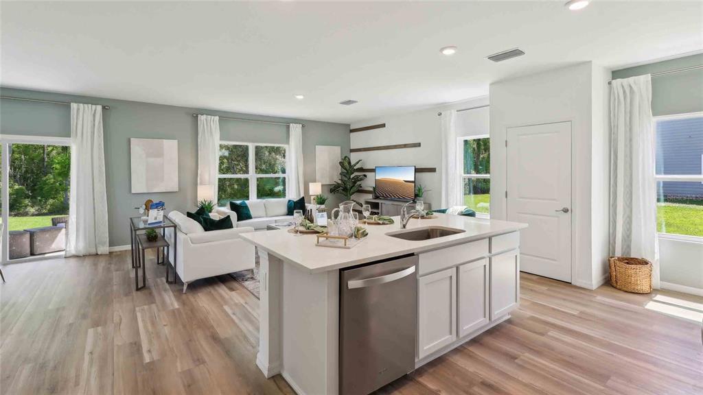 24478 Northwest 10th Road Newberry, FL 32669 - Photo 6 of 24 a kitchen with a sink stove and wooden floor