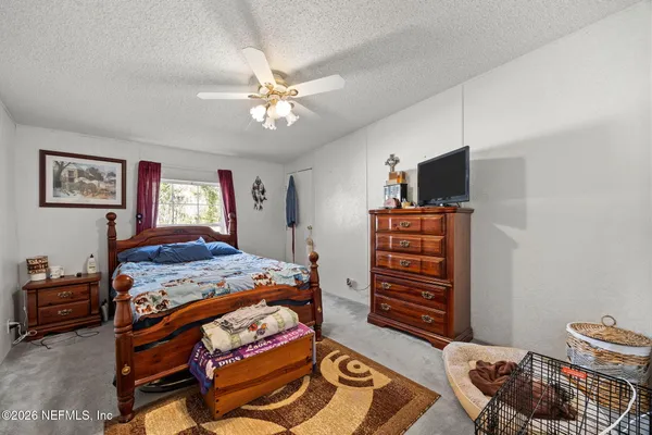 a bedroom with a bed and furniture